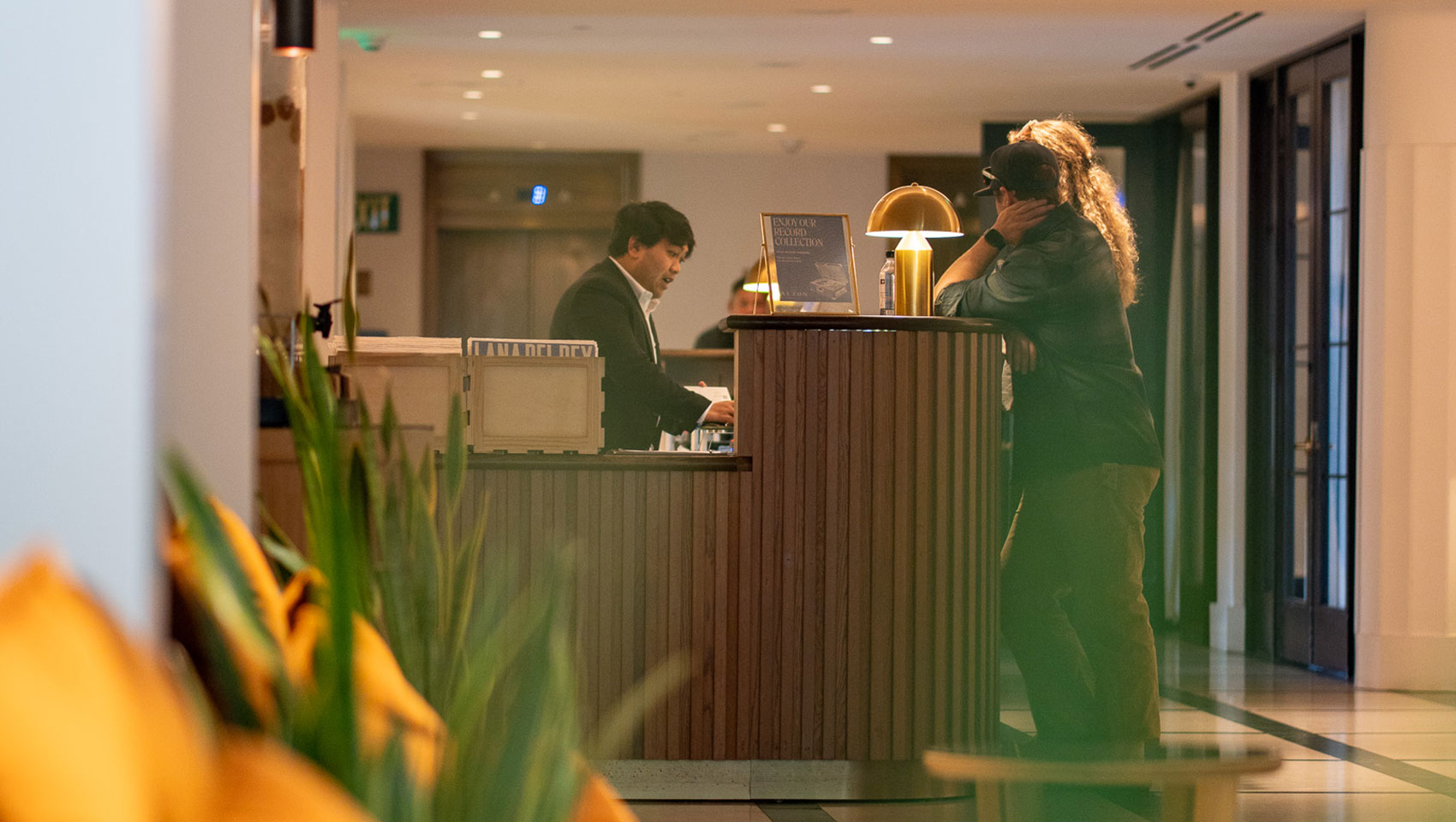 2 guests at front desk at kimpton alton hotel