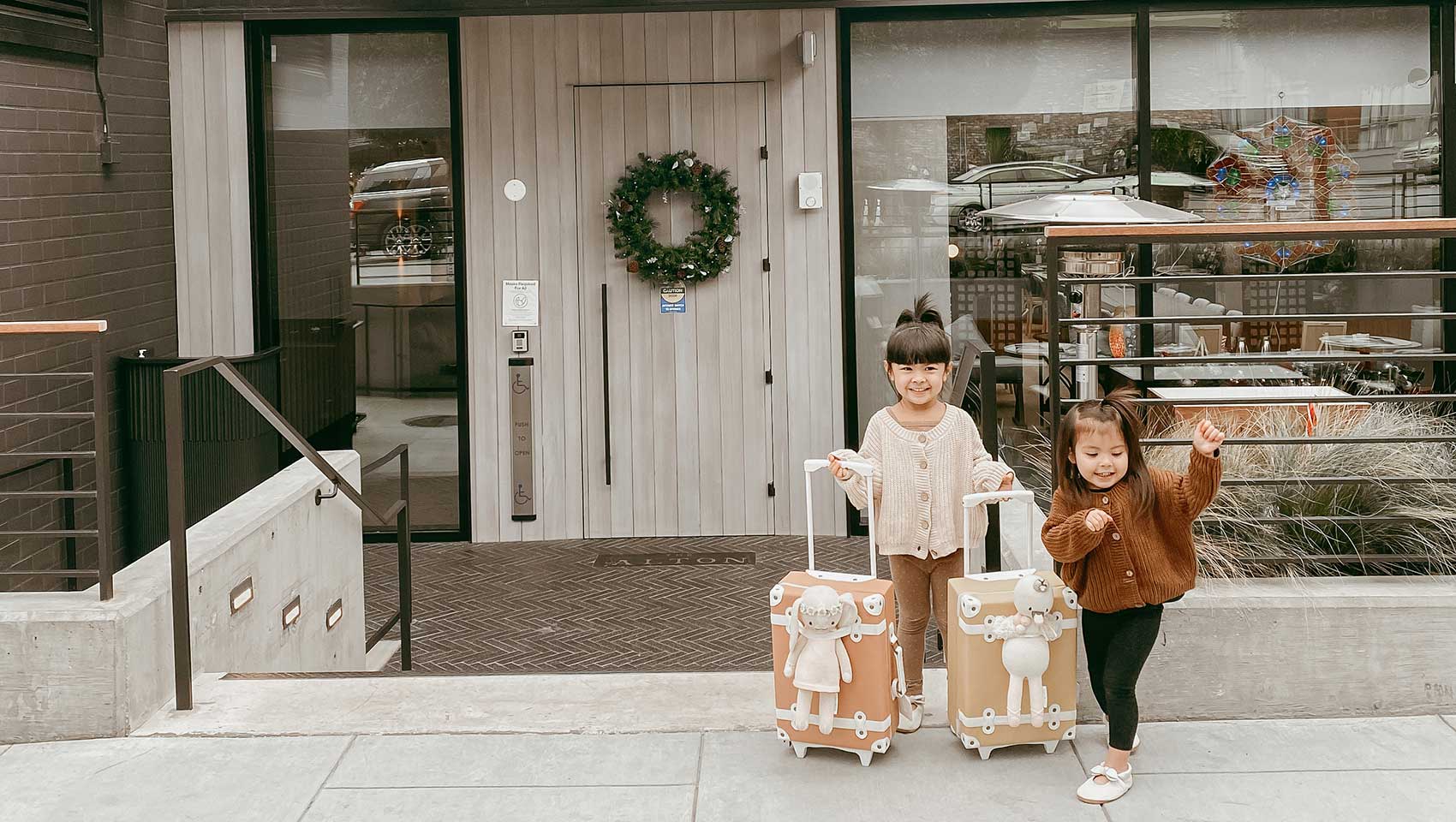 Kids outside Kimpton Alton Fisherman's Wharf with luggage