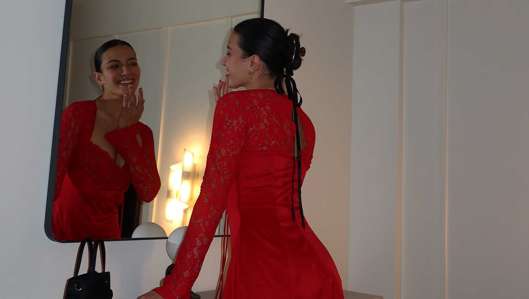 woman touches up look in mirror at Kimpton Alton Fisherman's Wharf